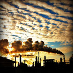 refi9nery at sunset with clouds